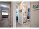 Guest bathroom with shower/tub combo, gray tile, and teal shower curtain at 11786 Sistine Ln, Venice, FL 34293