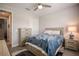 Bright bedroom with light wood furniture and a ceiling fan at 11786 Sistine Ln, Venice, FL 34293