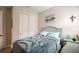 Bedroom with double bed, ocean-themed art, and large closet at 11786 Sistine Ln, Venice, FL 34293