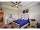 Spacious bedroom with a ceiling fan, large windows, and ample closet space at 11786 Sistine Ln, Venice, FL 34293