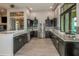 Modern community kitchen with granite counters and stainless steel appliances at 11786 Sistine Ln, Venice, FL 34293