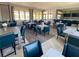 Elegant community room featuring ample seating and large windows at 11786 Sistine Ln, Venice, FL 34293
