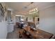 Open concept dining area with a view into the living room and kitchen at 11786 Sistine Ln, Venice, FL 34293