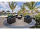 Inviting fire pit area with comfortable seating at 11786 Sistine Ln, Venice, FL 34293