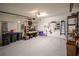 Organized garage with built-in shelving and overhead storage at 11786 Sistine Ln, Venice, FL 34293