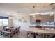 Modern kitchen with island, stainless steel appliances, and gray cabinets at 11786 Sistine Ln, Venice, FL 34293