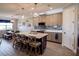 Modern kitchen with island, white countertops, and taupe cabinets at 11786 Sistine Ln, Venice, FL 34293