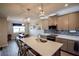 Modern kitchen with island, white countertops, and taupe cabinets at 11786 Sistine Ln, Venice, FL 34293