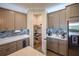 Kitchen with walk-in pantry and modern appliances at 11786 Sistine Ln, Venice, FL 34293