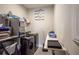 Laundry room with washer, dryer, shelving, and folding counter at 11786 Sistine Ln, Venice, FL 34293