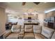 Living room with sectional sofa and view into kitchen and dining area at 11786 Sistine Ln, Venice, FL 34293