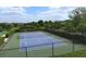 Well-maintained tennis court with surrounding fencing at 12117 Whisper Lake Dr, Bradenton, FL 34211