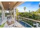 Covered balcony with outdoor dining set and pool view at 150 Grant Dr, Sarasota, FL 34236