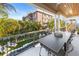 Covered balcony with outdoor dining set and pool view at 150 Grant Dr, Sarasota, FL 34236