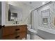 Modern bathroom with a soaking tub, stylish tile, and wood vanity at 150 Grant Dr, Sarasota, FL 34236
