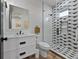 Modern bathroom with walk-in shower and geometric tile at 150 Grant Dr, Sarasota, FL 34236