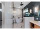 Luxury bathroom with a soaking tub, walk-in shower, and marble tile at 150 Grant Dr, Sarasota, FL 34236