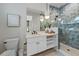 Bathroom with a walk-in shower and hexagon tile at 150 Grant Dr, Sarasota, FL 34236