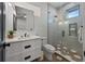Modern bathroom with walk-in shower and floating vanity at 150 Grant Dr, Sarasota, FL 34236