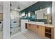 Modern bathroom with a double vanity, walk-in shower, and marble floors at 150 Grant Dr, Sarasota, FL 34236