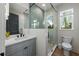 Modern bathroom with a walk-in shower and floating vanity at 150 Grant Dr, Sarasota, FL 34236