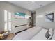 Bedroom with a dresser and a large TV at 150 Grant Dr, Sarasota, FL 34236