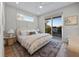 Bright bedroom with a king-size bed and private balcony at 150 Grant Dr, Sarasota, FL 34236