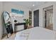 Bedroom with a full-length mirror and ensuite bathroom at 150 Grant Dr, Sarasota, FL 34236