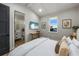 Bedroom with king bed and en-suite bathroom at 150 Grant Dr, Sarasota, FL 34236