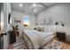 Bright bedroom with a king-size bed and sunset view at 150 Grant Dr, Sarasota, FL 34236