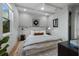 Bedroom with a king-size bed and wood accent wall at 150 Grant Dr, Sarasota, FL 34236