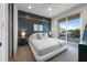 Bedroom with a white platform bed and access to balcony at 150 Grant Dr, Sarasota, FL 34236