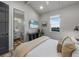 Bedroom with king bed, en-suite bathroom, and city view at 150 Grant Dr, Sarasota, FL 34236