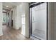 Modern glass elevator in hallway at 150 Grant Dr, Sarasota, FL 34236