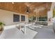 Outdoor entertainment area with pool table and seating at 150 Grant Dr, Sarasota, FL 34236