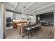 Open concept kitchen with island, breakfast bar, and view of dining area at 150 Grant Dr, Sarasota, FL 34236