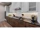 Modern kitchen with dark countertops, gas cooktop and ample cabinetry at 150 Grant Dr, Sarasota, FL 34236