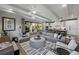 Spacious living room with sectional sofa and large windows at 150 Grant Dr, Sarasota, FL 34236