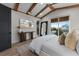 Main bedroom with a king-size bed, large mirror, and a view of the ocean at 150 Grant Dr, Sarasota, FL 34236