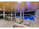 Inviting pool and spa area with covered patio and dining at 150 Grant Dr, Sarasota, FL 34236