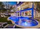 Luxury pool and spa with a slide, perfect for relaxation and fun at 150 Grant Dr, Sarasota, FL 34236