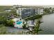 Aerial view highlighting the building, pool, and waterfront location at 1510 1St W Ave # 504, Bradenton, FL 34205