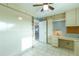 Bedroom with a desk, murphy bed and built-in shelves at 1510 1St W Ave # 504, Bradenton, FL 34205