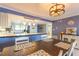 Dining area with table for four and view into kitchen at 1510 1St W Ave # 504, Bradenton, FL 34205
