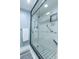 Large walk-in shower with glass enclosure and grab bars at 1510 1St W Ave # 504, Bradenton, FL 34205