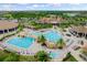 Resort-style pool with clubhouse and lush landscaping at 17825 Gawthrop Dr # 104, Bradenton, FL 34211