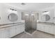 Spa-like bathroom with double sinks and a glass shower at 17825 Gawthrop Dr # 104, Bradenton, FL 34211