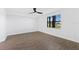 Well-lit bedroom with wood-look floors and ceiling fan at 17825 Gawthrop Dr # 104, Bradenton, FL 34211