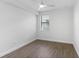 Bright bedroom featuring wood-look floors and ceiling fan at 17825 Gawthrop Dr # 104, Bradenton, FL 34211