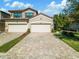 Two-story townhome with two-car garage and paver driveway at 17825 Gawthrop Dr # 104, Bradenton, FL 34211